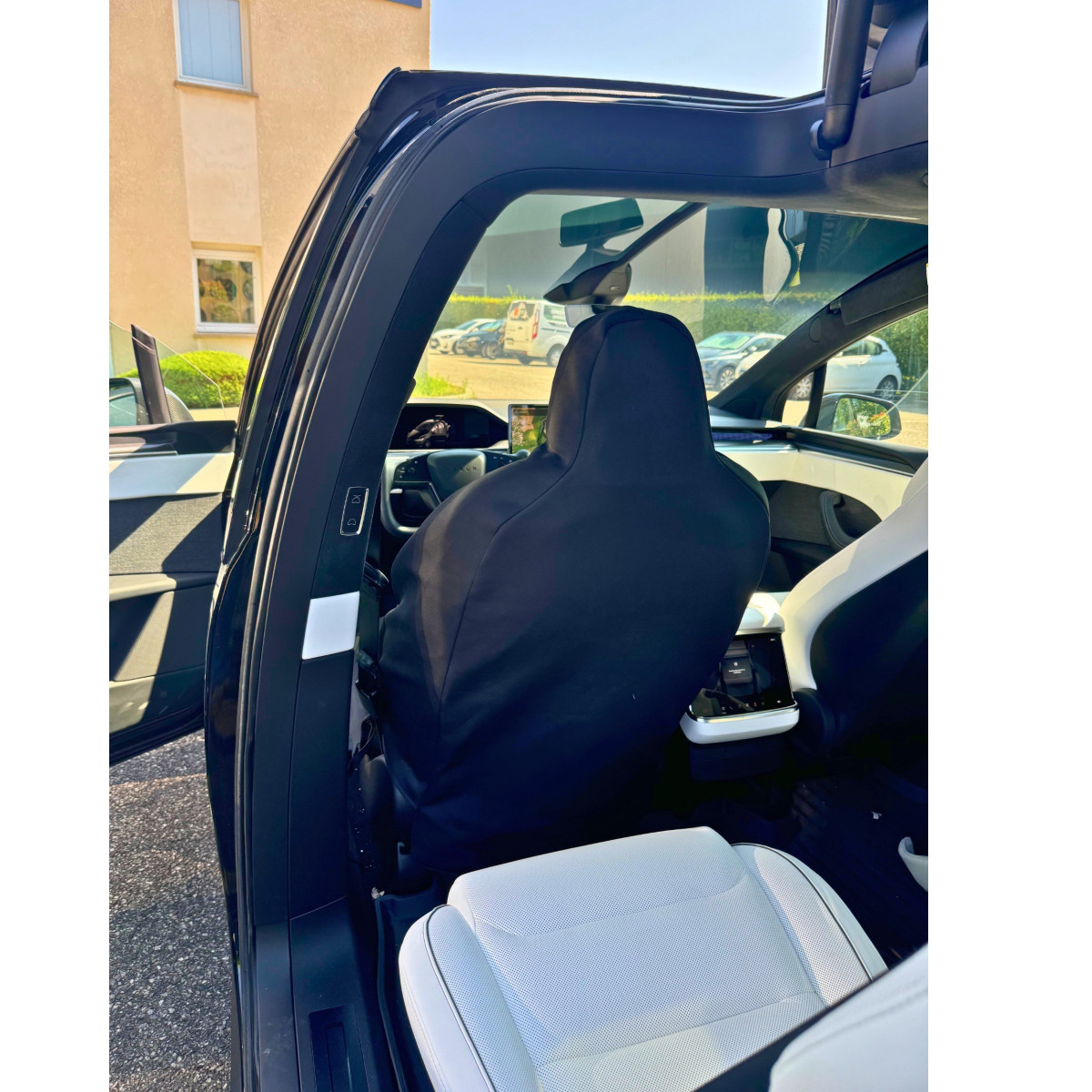 Vattentätt skyddsöverdrag för framsätet på Tesla